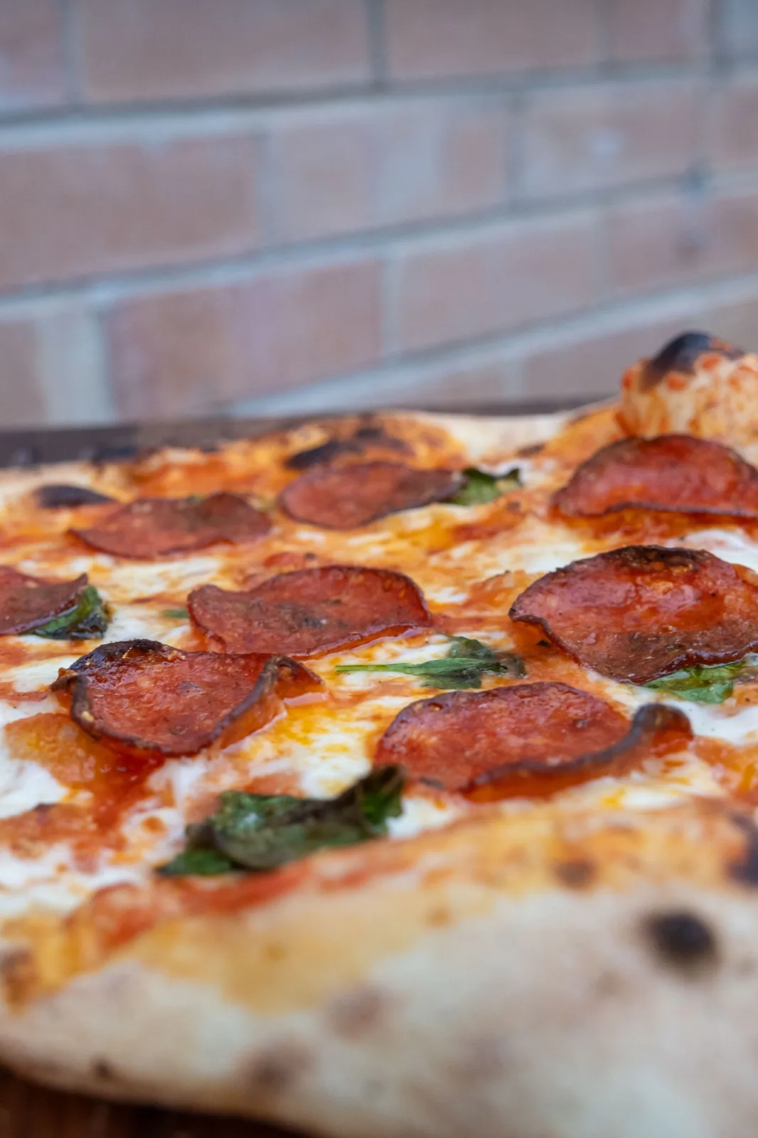 A margherita pizza on a wooden board